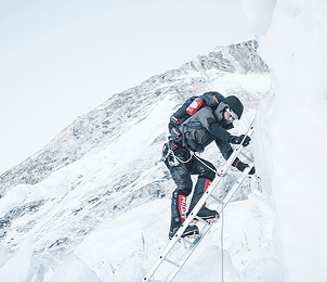 Climber approaching the summit ridge on high altitude route